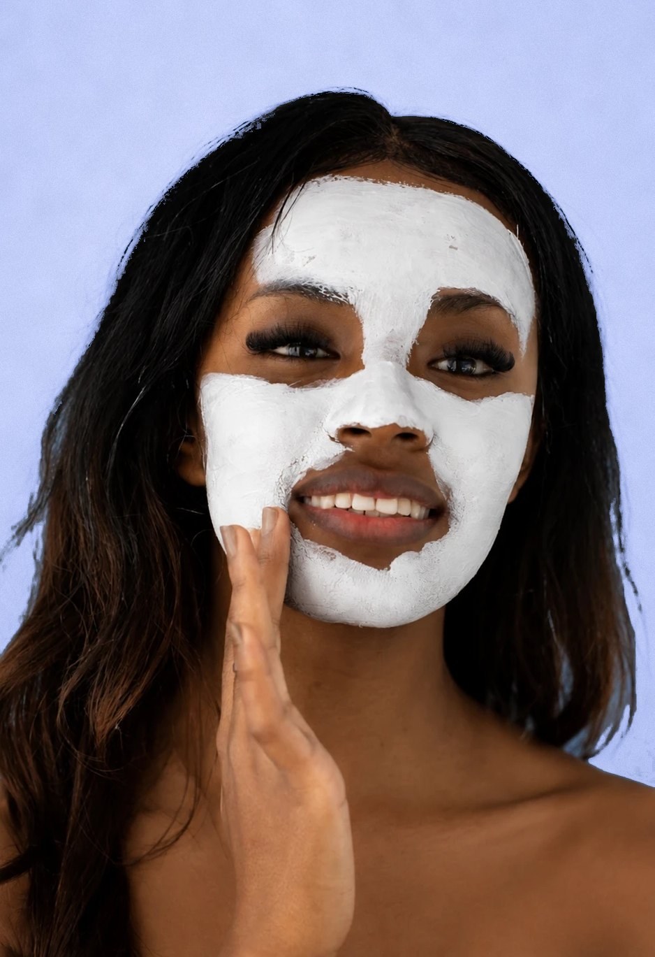 Black woman wearing a white facial mask